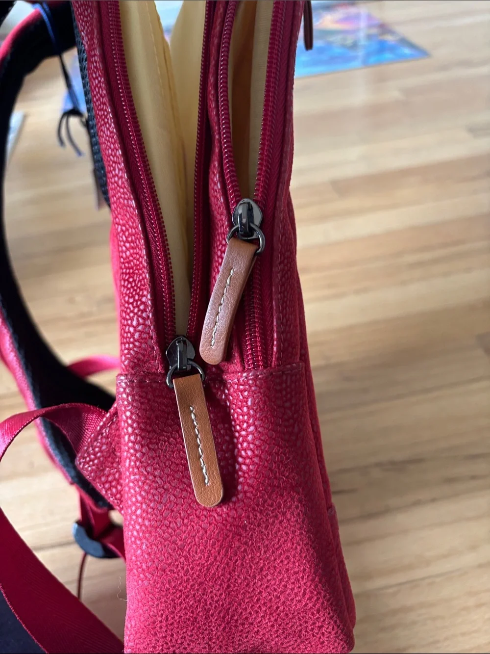 Bric's Red Pebbled Leather Backpack with Tan Accents